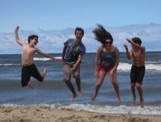 Kids jumping at beach